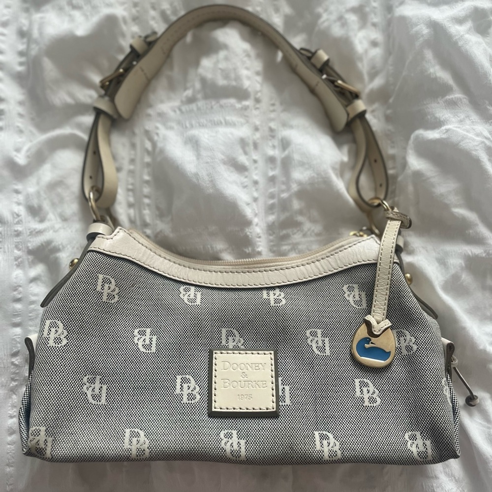 Dooney & Bourke purse, used , some stains . Good condition.